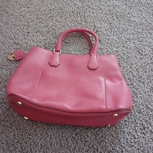 Michael kor handbag in good shape has one zipper on the side inside.